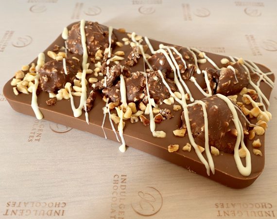 Tempered Belgian Chocolate Slab with Ferrero Rocher topping available with Indulgent Praline Ganache filling